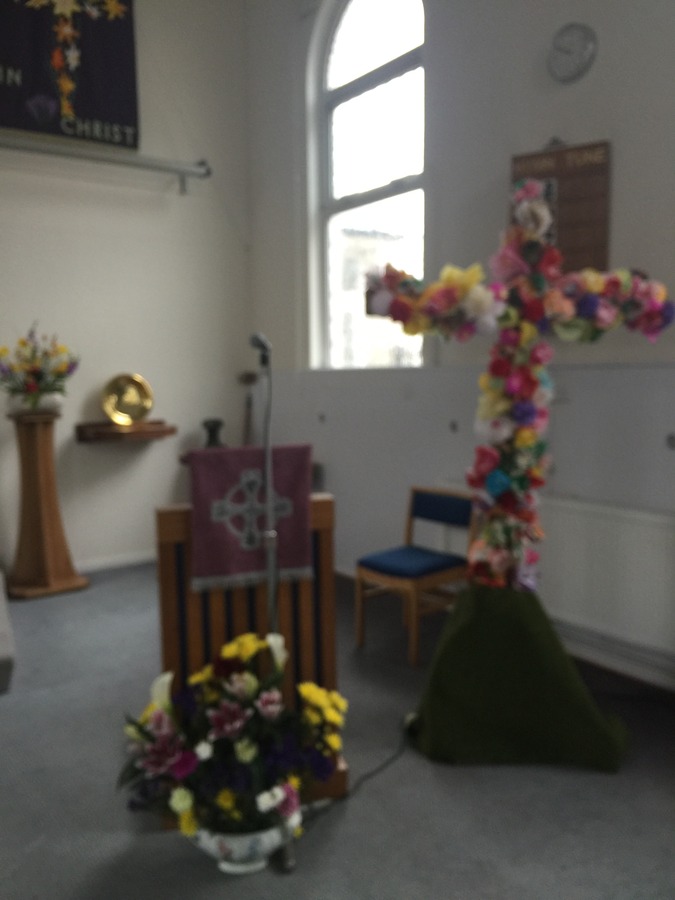 Cross covered in flowers